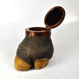 An elephant foot tobacco jar with hinged ebony lid, copper collar and wooden liner, height 21cm.