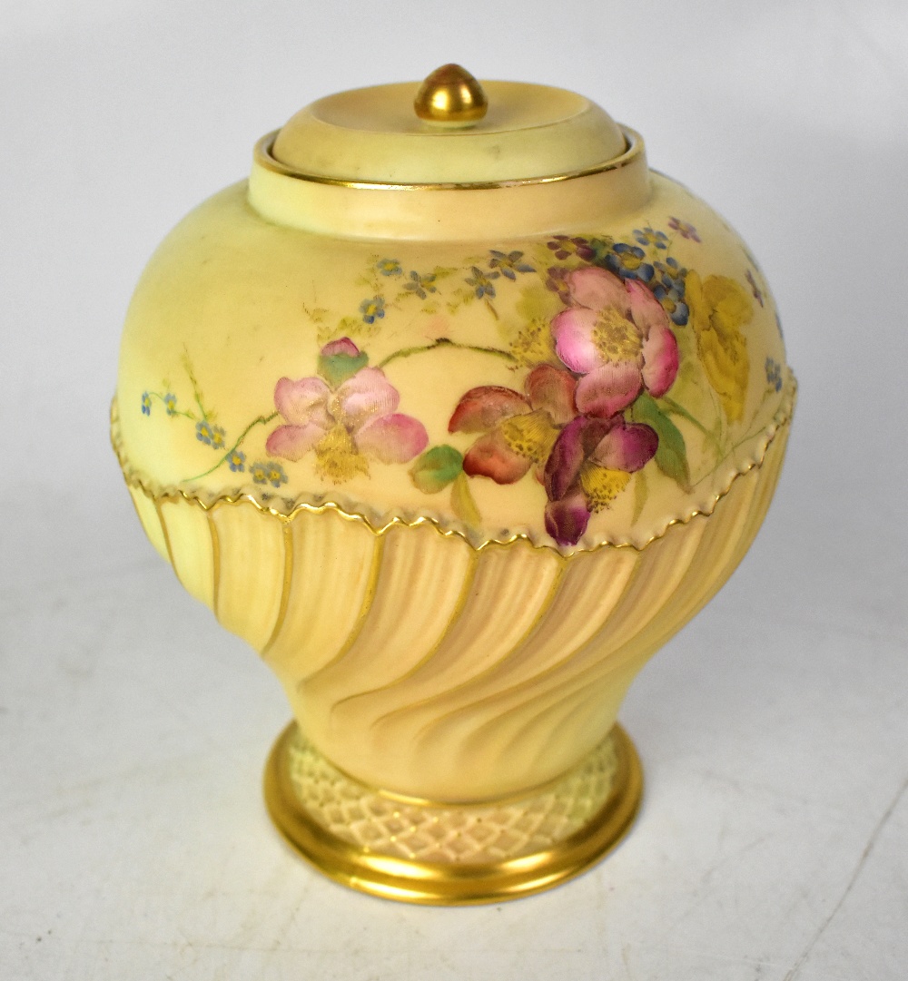 ROYAL WORCESTER; a blush ivory baluster vase with cover,