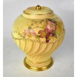 ROYAL WORCESTER; a blush ivory baluster vase with cover,