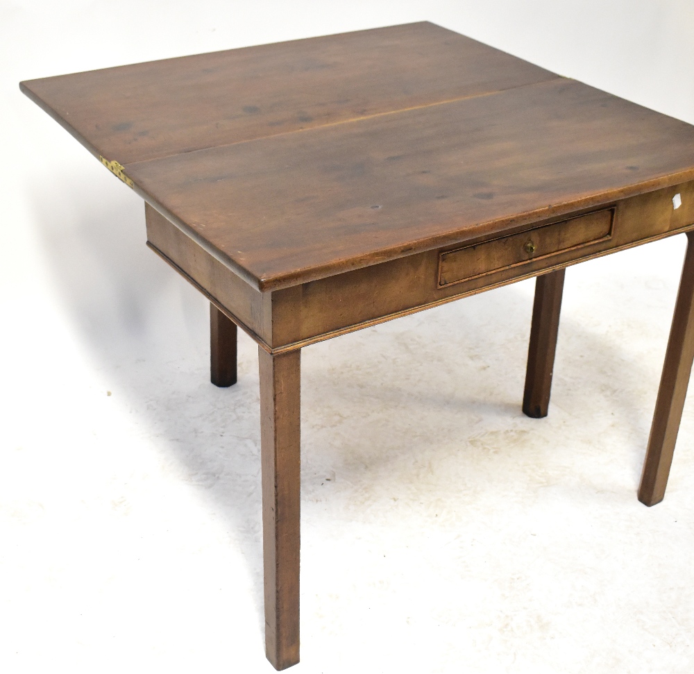 A mahogany fold-over tea table with single frieze drawer, raised on square section supports, - Image 2 of 2