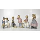 NAO; five figures of children comprising two boys and two girls,
