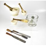 PHARMACEUTICAL INTEREST; three early 20th century stoneware pestles and mortars of varying sizes,