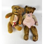 Two vintage teddy bears, to include an early 20th century straw-filled example with glass eyes,