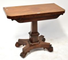 A Victorian mahogany fold-over tea/games table to column support and quadripartite base,