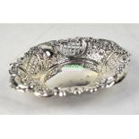 An Elizabeth II hallmarked silver pierced shaped dish with embossed floral decoration,