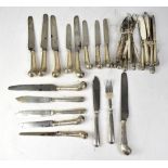 A quantity of various Georgian and Victorian white metal knives and forks, some with pistol handles,