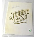 JOHNNY CASH; a tour programme bearing the star's signature and that of June Carter Cash.