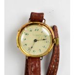 WALTHAM; an 18ct gold wristwatch, the circular dial set with Arabic numerals,