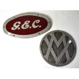 Two 20th century embossed metal signs, 'GEC', 25.5 x 45.5cm and 'VW', diameter 31cm (2).