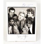 PUBLIC IMAGE; a black and white promotional photograph bearing the twin signatures of Johnny Rotten.