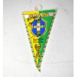 BRAZIL; a pennant bearing the signatures of Pele, Sócrates, etc.