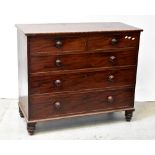 A Victorian mahogany chest of two short over three long drawers, raised on turned feet,