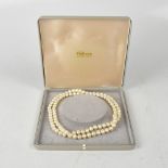 A single strand necklace of well matched cultured pearls.