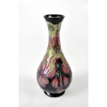 MOORCROFT; a slender baluster tube lined vase in 'Fuchsia' design, height 16cm,