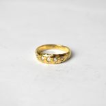 A gold dress ring set with five diamonds in marquise setting, size O1/2, approx 3.7g, marks rubbed.