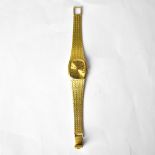 TISSOT; an 18ct yellow gold ladies' tank-style wristwatch,