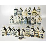 A collection of Dutch Delft ware style bottles for KLM Airlines, in the form of town houses,