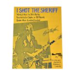 ERIC CLAPTON; sheet music for 'I Shot the Sheriff', bearing his signature and two others.