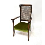 An Edwardian mahogany high back bergère chair,