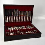 A contemporary mahogany cased set of six-setting cutlery from Harrods of London.