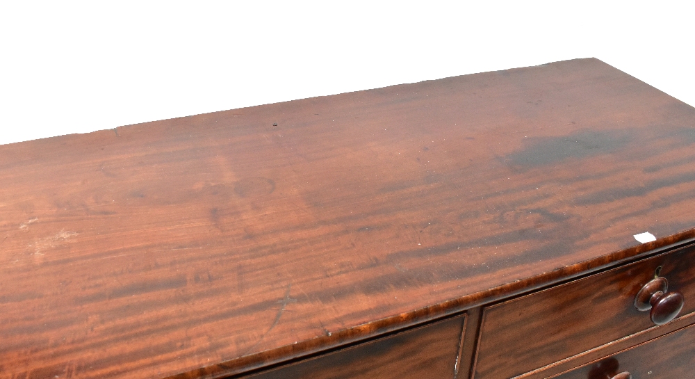 A Victorian mahogany chest of two short over three long drawers, raised on turned feet, - Image 2 of 2