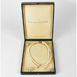 BOODLE & DUNTHORNE; a double-strand well matched pearl necklace,