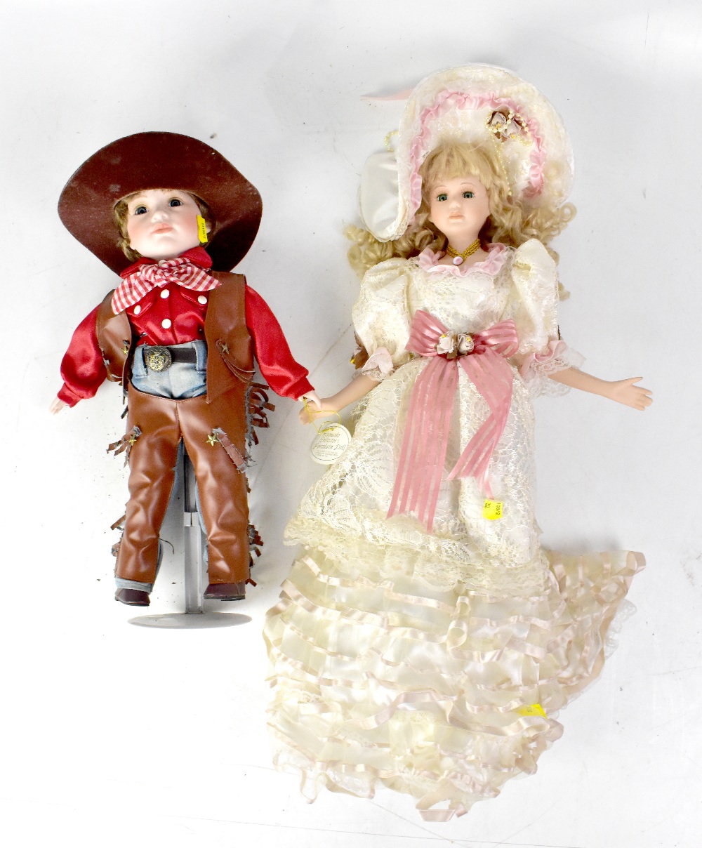 A quantity of modern bisque dolls, some by Leonardo Collection, to include one dressed as a cowboy,