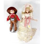 A quantity of modern bisque dolls, some by Leonardo Collection, to include one dressed as a cowboy,