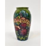 MOORCROFT; a tube lined green variegated ground baluster vase in the 'Finches' pattern, height 19.