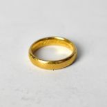 A 22ct yellow gold wedding band, size I1/2,approx 4.6g.