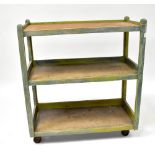 A 1930s three-tier baker's stand on castors, painted in a green and blue finish,