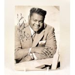 FATS DOMINO; a black and white promotional photograph bearing his signature.