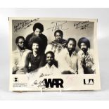 WAR; a promotional black and white photograph bearing the band's signatures,