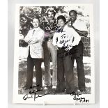 MAGNUM PI; a black and white photograph bearing signatures of the four stars including Tom Selleck,