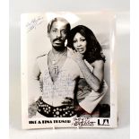 TINA TURNER; a black and white photograph of Ike and Tina Turner, signed by both stars, 25 x 21cm.