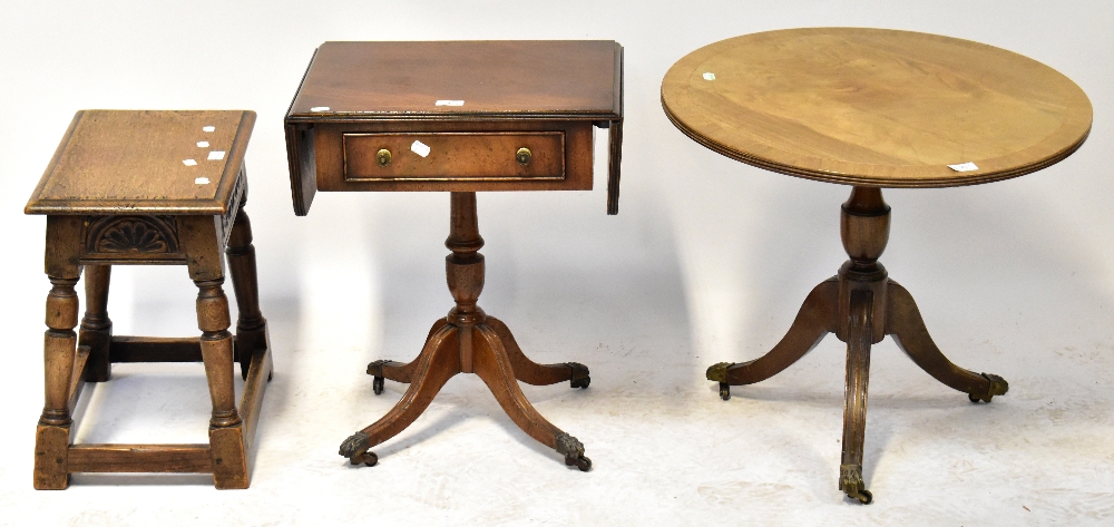 Three pieces of reproduction occasional furniture comprising a mahogany line inlaid sofa table of