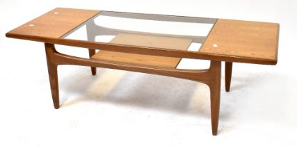 G-PLAN; a 'Fresco Longjohn' coffee table with glass top and lower shelf to splayed supports,