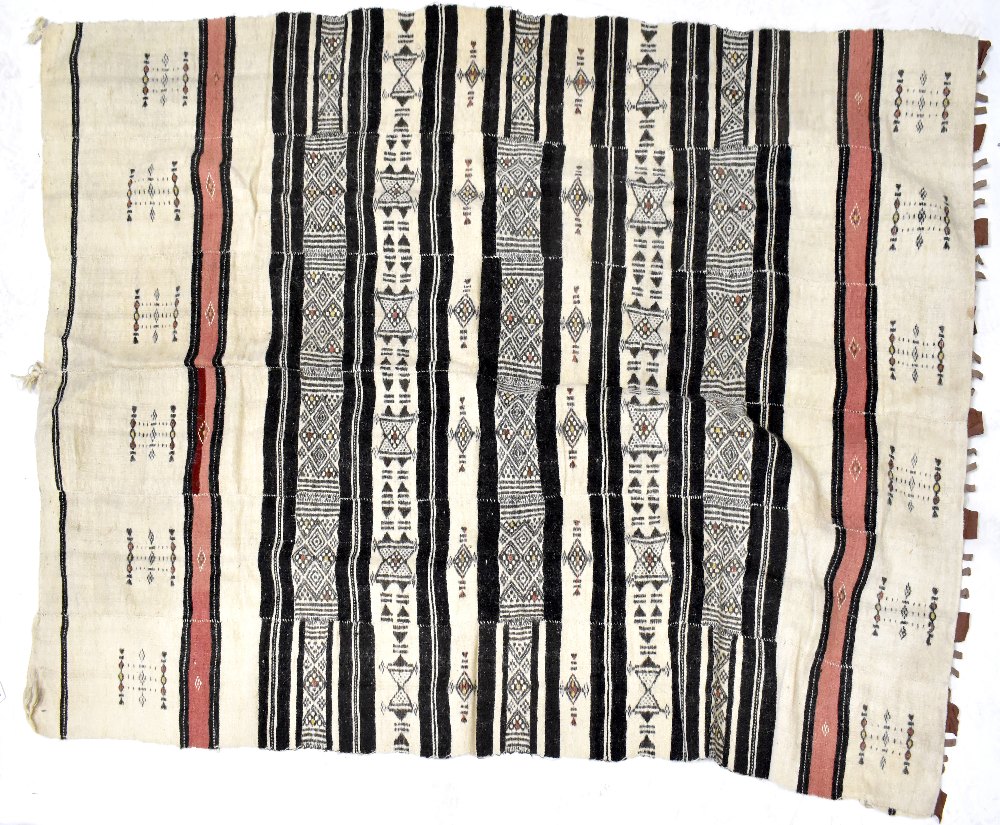 A Nigerian goat hair rug with bands of geometric decoration, 230 x 135cm.