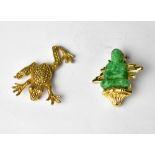 A yellow metal brooch with jade figure in the Oriental style,