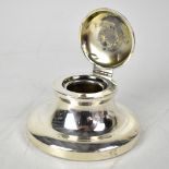 A George V hallmarked silver capstan inkwell, with hinged lid,