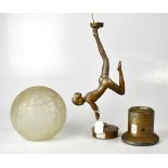 An Art Deco style gilded table lamp modelled as a nude female, with crackle-effect globular shade,