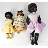 Three early/mid-20th century dolls comprising a Pedigree doll in original lilac silk dress,