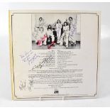 AVERAGE WHITE BAND; an album bearing the signatures of the band members to the reverse.