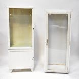 Two white metal industrial floorstanding shelving units, with glazed cupboard doors,