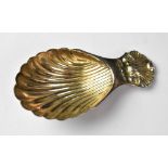 An Elizabeth II hallmarked silver shell-shaped caddy spoon, length 8cm, C J Vander Ltd, London 1976,