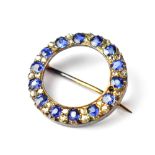 An early 20th century yellow metal sapphire and diamond set brooch,
