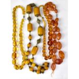 Five amber-style necklaces, various shapes and colours (5).