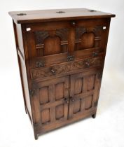 REPRODUX; a an oak drinks cabinet,