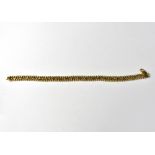 An 18ct yellow gold three-line beaded bracelet, length approx 20cm, approx 14g.