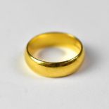 A 22ct gold band ring, inscribed to interior 'Gary and Pam 15.4.00', size U, approx 8g.